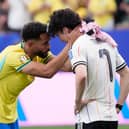 CLASS: Shown by Brazil's Manchester United striker Matheus Cunha to console Leeds United ace Ao Tanaka as Japan exit the World Cup.