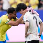 CLASS: Shown by Brazil's Manchester United striker Matheus Cunha to console Leeds United ace Ao Tanaka as Japan exit the World Cup.