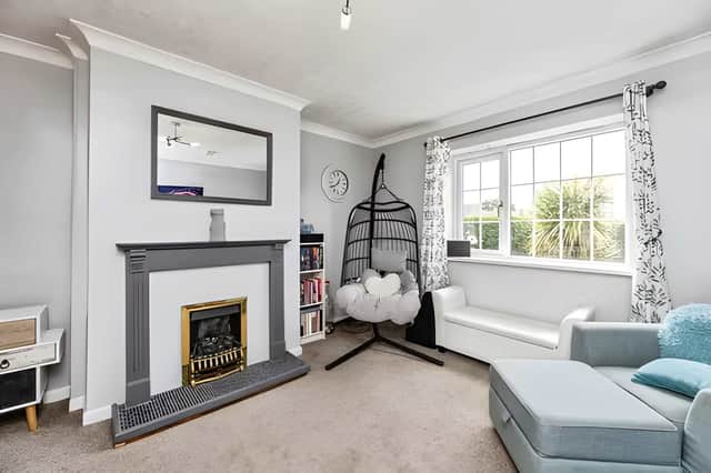 A generously sized living room provides a welcoming space to relax, entertain or spend time together.