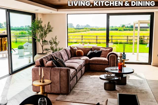 Huge sliding doors connect the main living area with the porcelain terrace and uninterrupted Lancashire countryside views