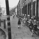 Children playing on  Burley Lodge Road in October 1970.