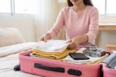 From tech to fashion and beauty staples, these are the products worth packing when you travel. Photo posed by model.