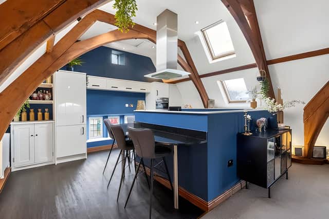 The modern kitchen forms part of an impressive open-plan space designed for everyday living and entertaining.