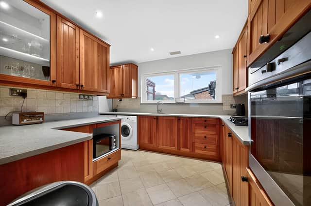 The kitchen sits at the heart of a layout designed to support busy family life and entertaining alike.