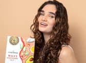 The Curlsmith Discovery Kit includes four premium curl care products designed to cleanse, moisturise, style and refresh curly hair. Photo posed by model.