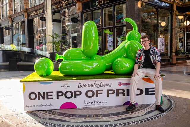 One of the iconic neon-green POPek Balloon Dog sculptures in the Victoria Quarter for the launch of the 'One Pop of Pride' exhibition this summer.