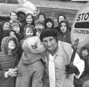 Sally Bowers, aged nine, plants a kiss on the cheek of lollipop lady Mary Thrippleton, aged 70, who has completed 20 years as a lollipop lady outside New Park Primary School, Harrogate, in December 1973