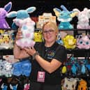 Pictured trader Natasha Ayling on her stall holding Sylveon cuddly toy. 