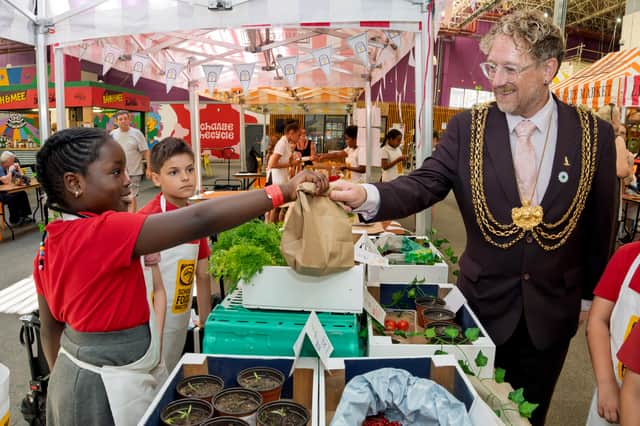 The Lord Mayor of Leeds, Councillor Stephen Holroyd, at the Young Marketeers event at Leeds Kirkgate Market.