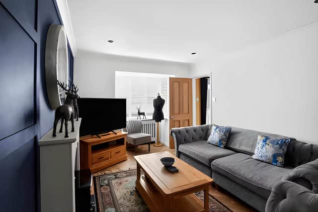 The spacious lounge provides a welcoming retreat while complementing the home's flexible family layout.