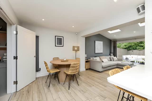 A separate living room offers a comfortable place to unwind while complementing the home's flexible layout.