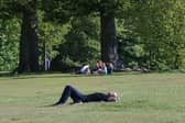 People enjoy the sunshine in Roundhay Park in Leeds.