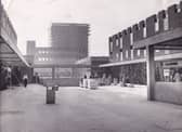 The upper precinct of the Seacroft Shopping Centre in October 1965. In the background is a 17-storey block of flats.