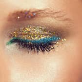 Glitter primers, sparkling eyeshadows and shimmering lip glosses are among this year's festival beauty essentials. Photo posed by model.