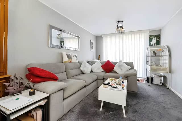 French doors and dual-aspect windows fill the main living space with natural light and connect seamlessly to the garden.
