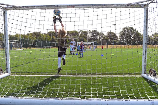 At the Summer Soccer School, children hone their football skills in a fun and inclusive environment