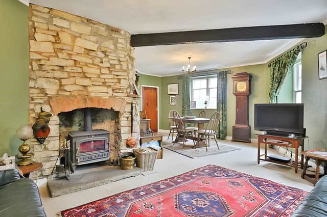 The welcoming lounge, complete with its log-burning stove, provides a cosy focal point throughout the year.