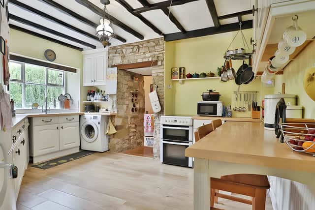 Everyday living is supported by practical spaces that complement the property's traditional appeal.