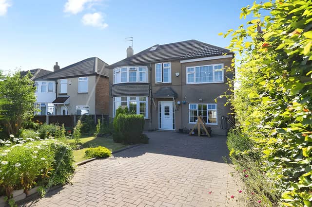 The impressive frontage reflects the generous scale of this substantial detached family home set on a private plot.