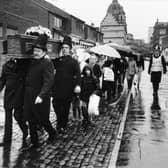 October 1986 and traders deliver a petition opposing council plans to redevelop Kirkgate Market.