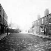 Taken prior to the Hope Street improvements looking north up Bridge Street, showing retail premises in this predominantly Jewish quarter. Shops visible are: Morris Hyman, tailors trimmings: Max Philips, confectioner: Ralph Levi, bookseller.