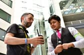 Tristram Margison of LeedsBCRP, left, with a security officer getting a new radio