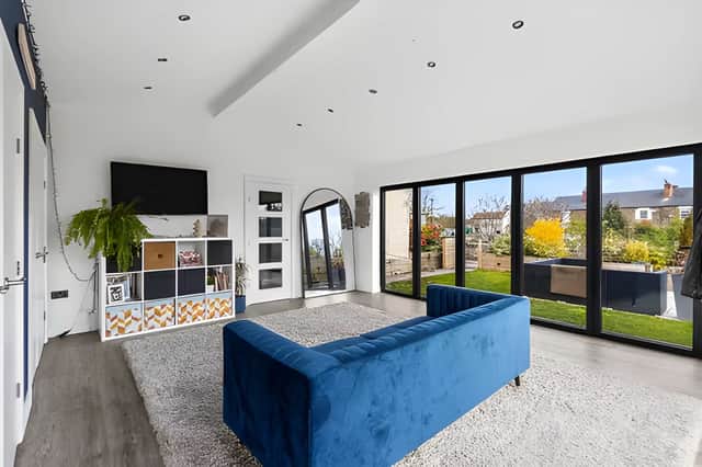 The landscaped rear garden extends the living space outdoors and complements the peaceful village setting.