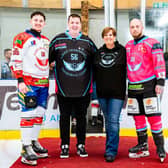 Jamie and Lewis alongside Greg's family 