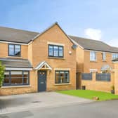The attractive frontage and driveway offer a welcoming first impression of this spacious modern family home.