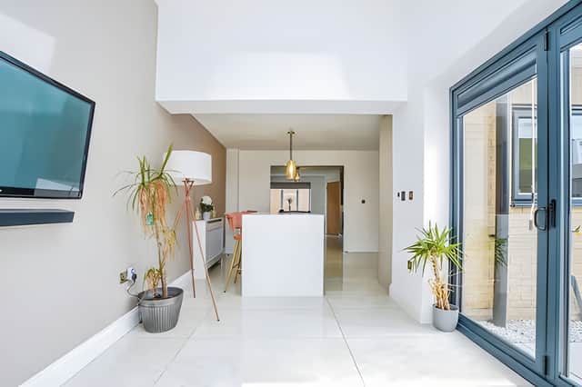 One of two versatile reception rooms provides a comfortable setting for relaxing while adapting easily to modern family living.