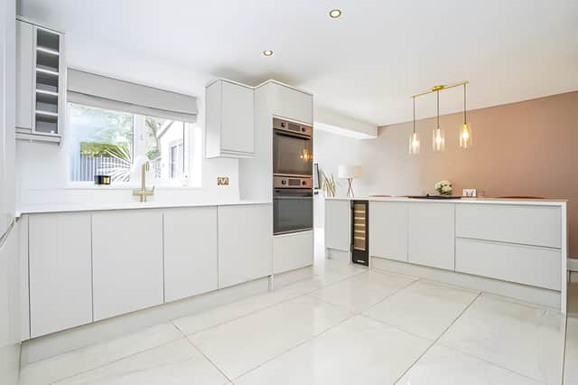 The open plan kitchen with its central island has been designed as the social heart of the home for family life and entertaining.