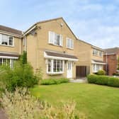 Behind secure gates, this detached family home makes an impressive first impression from its quiet cul-de-sac position.
