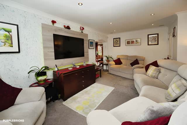 A bay-fronted living room with surround sound flows naturally into the dining area for easy entertaining.