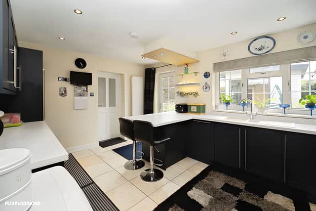 The upgraded dining kitchen forms the social heart of the home with modern finishes and space for everyday family life.