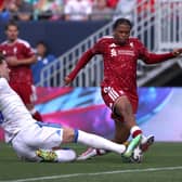 Joe Rodon committed as ever to produce an early challenge on Rio Ngumoha.
