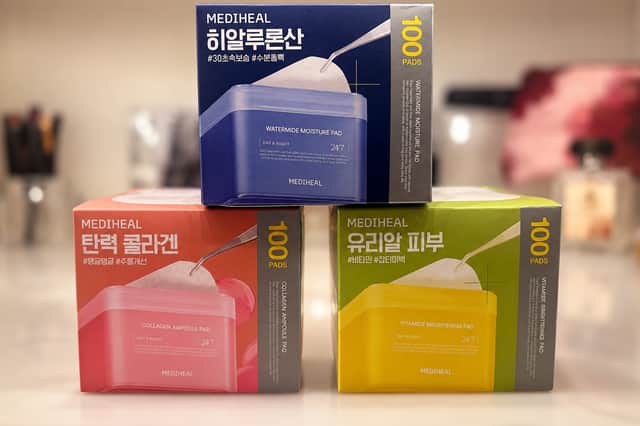 Three Mediheal Korean skincare Daily Pad boxes, including Watermide Moisture, Collagen Ampoule and Vitamide Brightening, pictured before unboxing.