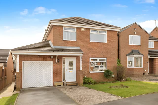 Positioned within a sought-after residential development, this detached home makes an inviting first impression with its smart exterior and family-friendly setting