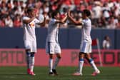 PUT IT THERE: Leeds United captain Ethan Ampadu, right, celebrates with goalscorer Brenden Aaronson and new signing Tarik Muharemovic.