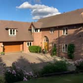 Behind private gates, this substantial village home makes a striking first impression in a secluded setting.