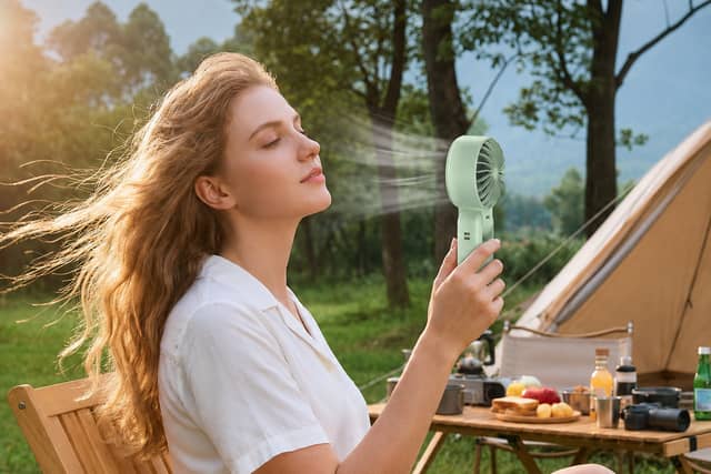 The light green TECKNET handheld fan is reduced to £10.11 in an Amazon limited-time deal