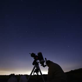 Members of the York Astronomical Society prepare to view the annual Perseids meteor shower in the village of Rufforth, near York, northern England on 12 August 2015.