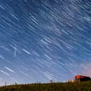 A meteor and star trails during the Perseid meteor shower seen from near Hawes in the Yorkshire Dales National Park
