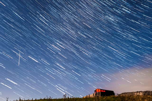A meteor and star trails during the Perseid meteor shower seen from near Hawes in the Yorkshire Dales National Park