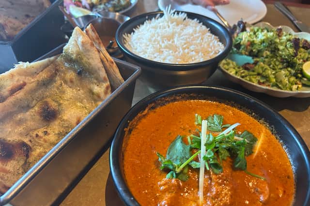 The chicken ruby curry, spicy broccoli salad, steamed basmati rice and masala paratha