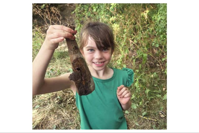 Amelia holding the prized discovery