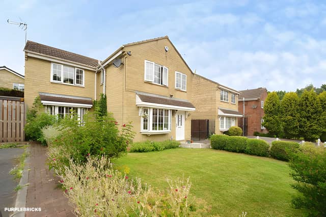 The detached Oakdene Way home occupies a discreet cul-de-sac position with a gated driveway leading to its detached garage
