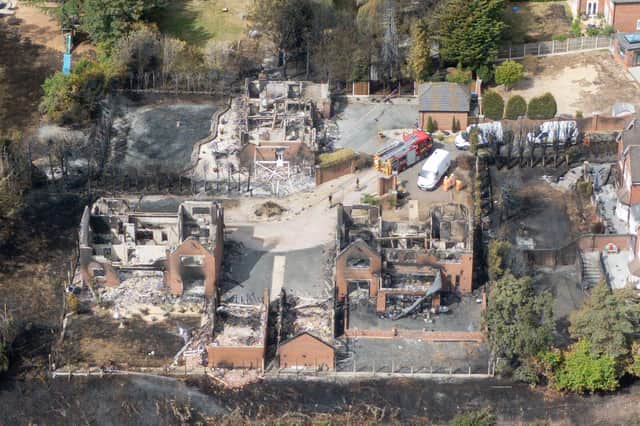 The burnt out remains of houses following a huge blaze in Stourbridge, in the West Midlands, which forced some people to flee after it started tearing through homes.
