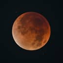 The blood Moon is pictured during an eclipse in the night sky in Shanghai on 8 September 2025.