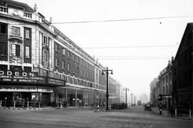 The Headrow, looking east from the junction with Briggate towards Eastgate in November 1944. The Odeon cinema was showing The Song Of Bernadette.