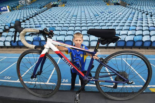 18th August 2026
10-year-old  Charlie Collis who will be undertaking an extraordinary charity challenge this August in aid of Cancer Research UK.
In memory of his grandad, who sadly passed away from cancer at the age of just 65, Charlie will be cycling an incredible 970 miles over 16 consecutive days, visiting all 20 Premier League stadiums across England
Pictured Charlie with his bike at Elland Road.
Picture Gerard Binks
